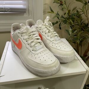 Nike White Low-Top Sneakers with Coral Swoosh